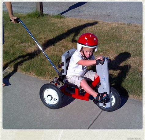 Amtryke bike being ridden by a small child.