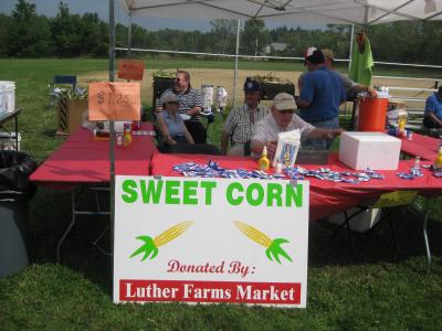 Corn sale table at community day.