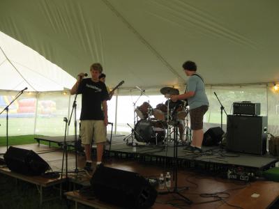 members of a band playing at community day